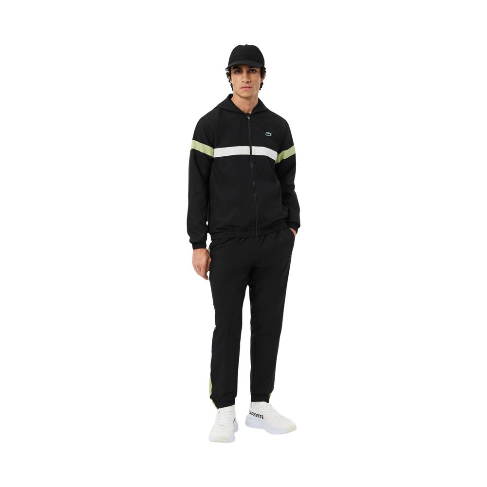Experience the allure of the Lacoste Black And White Polyester Sweatsuit, a seamless blend of sophistication and comfort, crafted for the discerning individual.