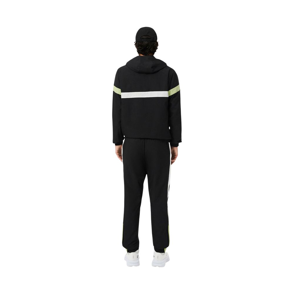Experience the epitome of elegance with the Lacoste Black And White Polyester Sweatsuit, crafted from luxurious 100% polyester for unparalleled comfort and style.