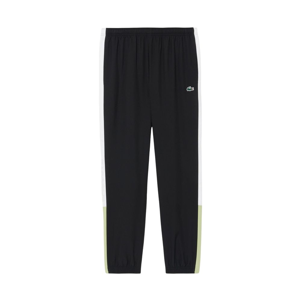 Discover the Lacoste Black And White Polyester Sweatsuit, a blend of contemporary elegance and comfort, crafted for those who embrace luxury in every moment.