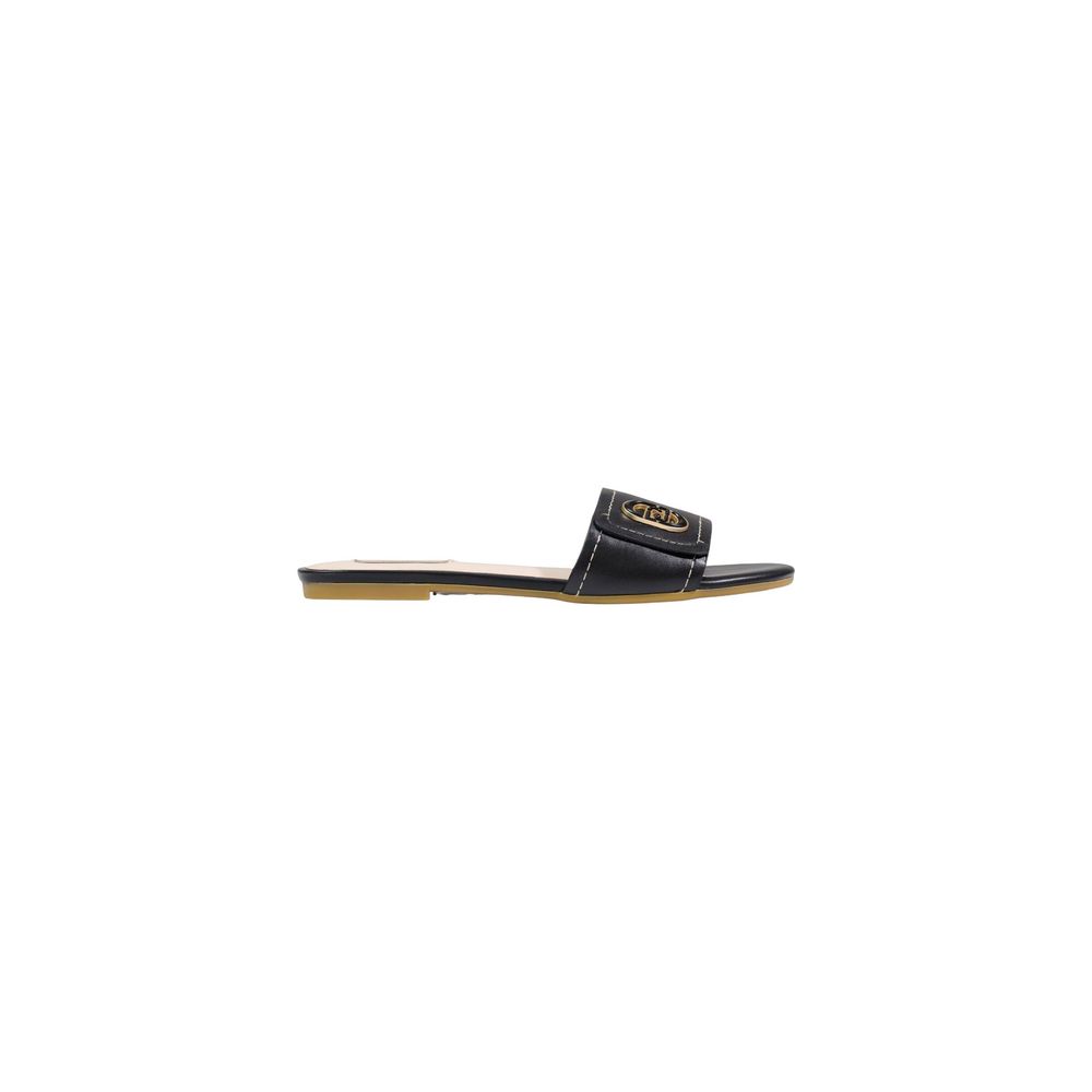 Experience the allure of Liu Jo Black Leather Flat Sandals, a seamless blend of minimalist elegance and expert craftsmanship, perfect for elevating any ensemble.
