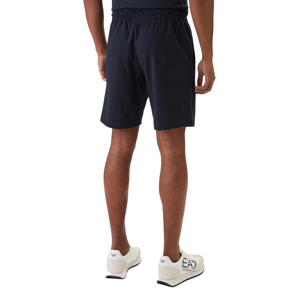 Elevate your leisurewear with the EA7 Emporio Armani Blue Cotton Bermuda Shorts, crafted from luxurious cotton for effortless elegance and timeless style.