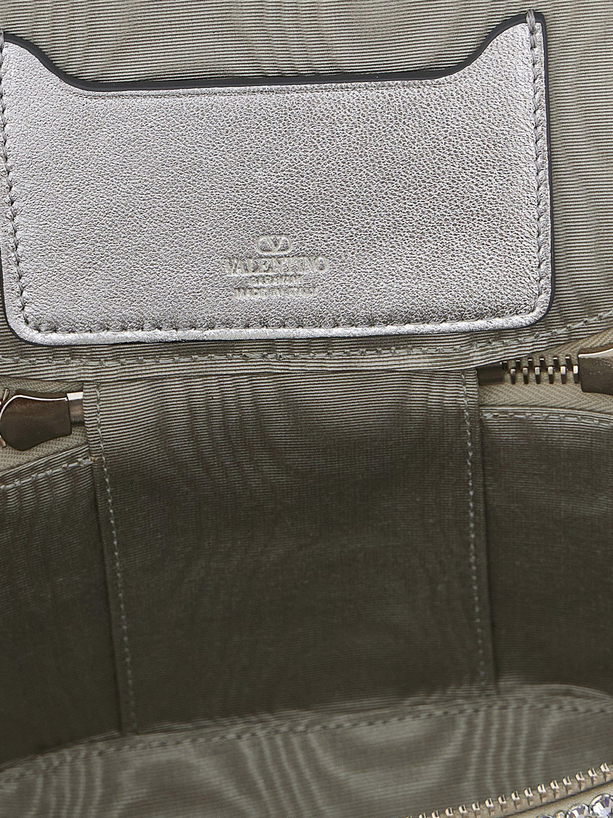 Discover the Valentino Garavani Silver Viscose Handbag, a masterpiece of Italian craftsmanship, blending opulence with modern elegance for the discerning connoisseur.