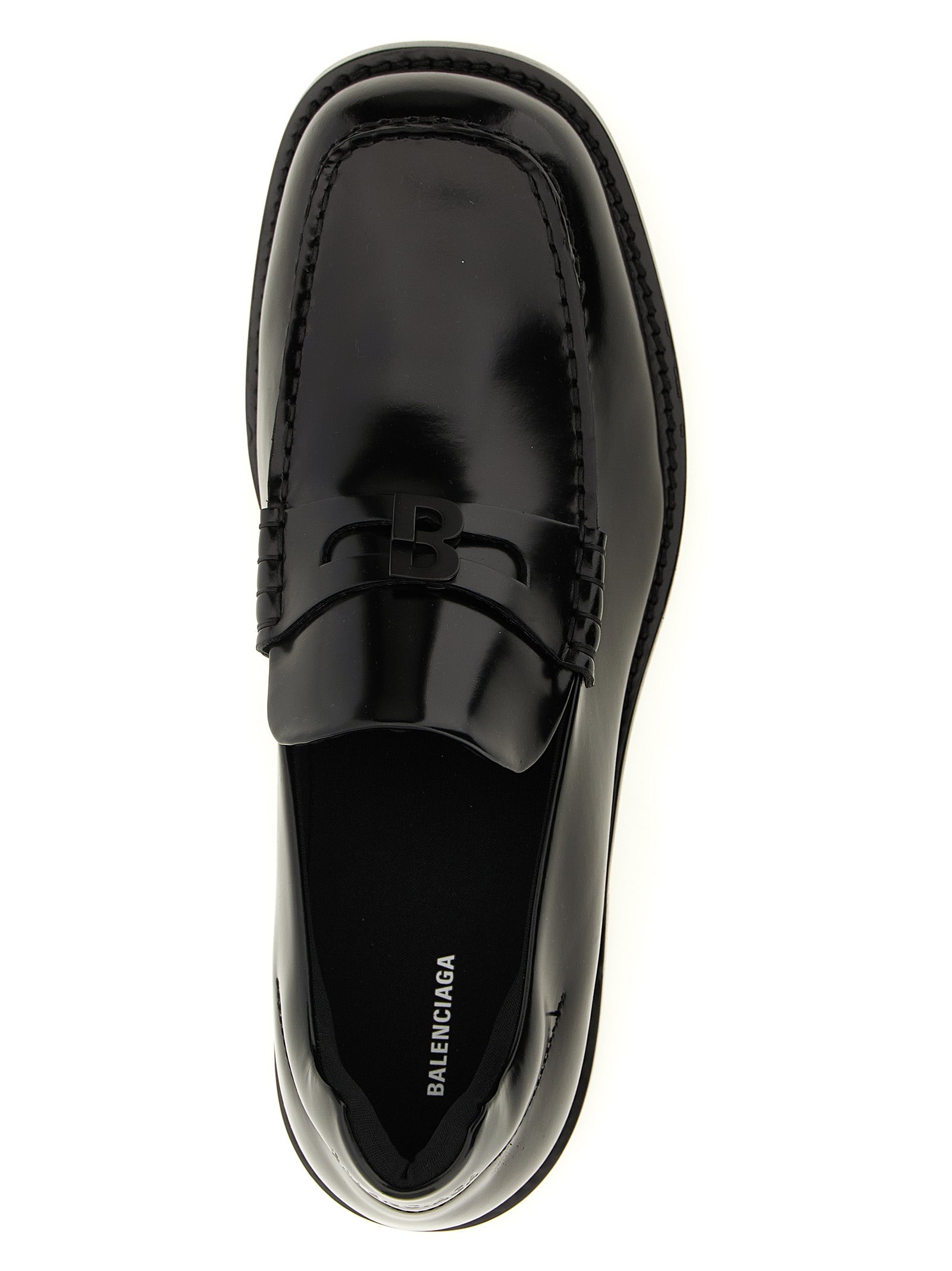 Elevate your presence with Balenciaga Black Calfskin Slip-On Loafers, where exquisite craftsmanship meets timeless elegance, perfect for the discerning individual.