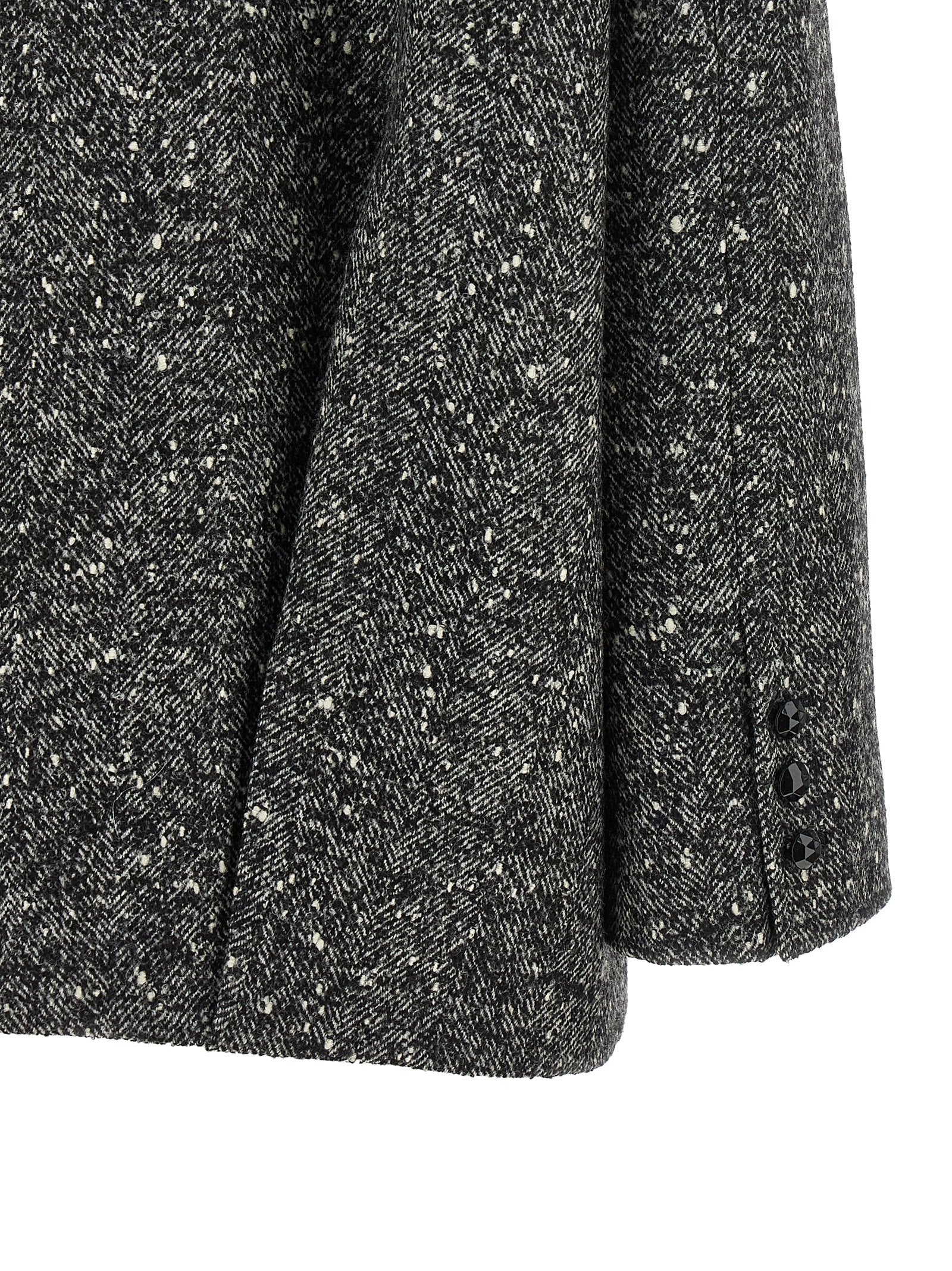 Elevate your winter wardrobe with the Valentino Garavani Bicolor Virgin Wool Coat, a masterpiece of tailored elegance and luxurious craftsmanship, perfect for any sophisticated occasion.