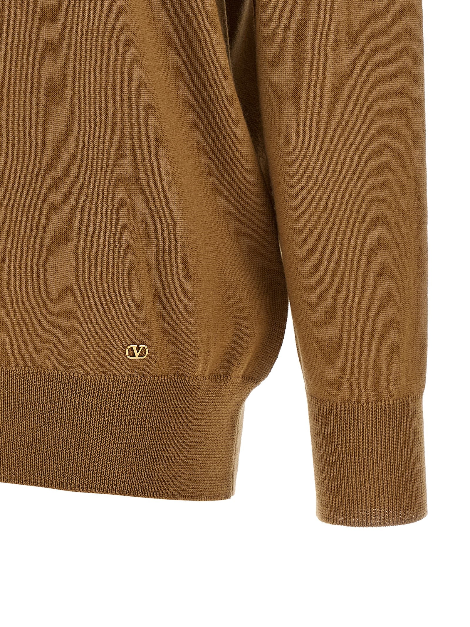 Indulge in the timeless elegance of the Valentino Garavani Brown Cashmere Cardigan, crafted from luxurious cashmere, embodying superior craftsmanship and chic sophistication.