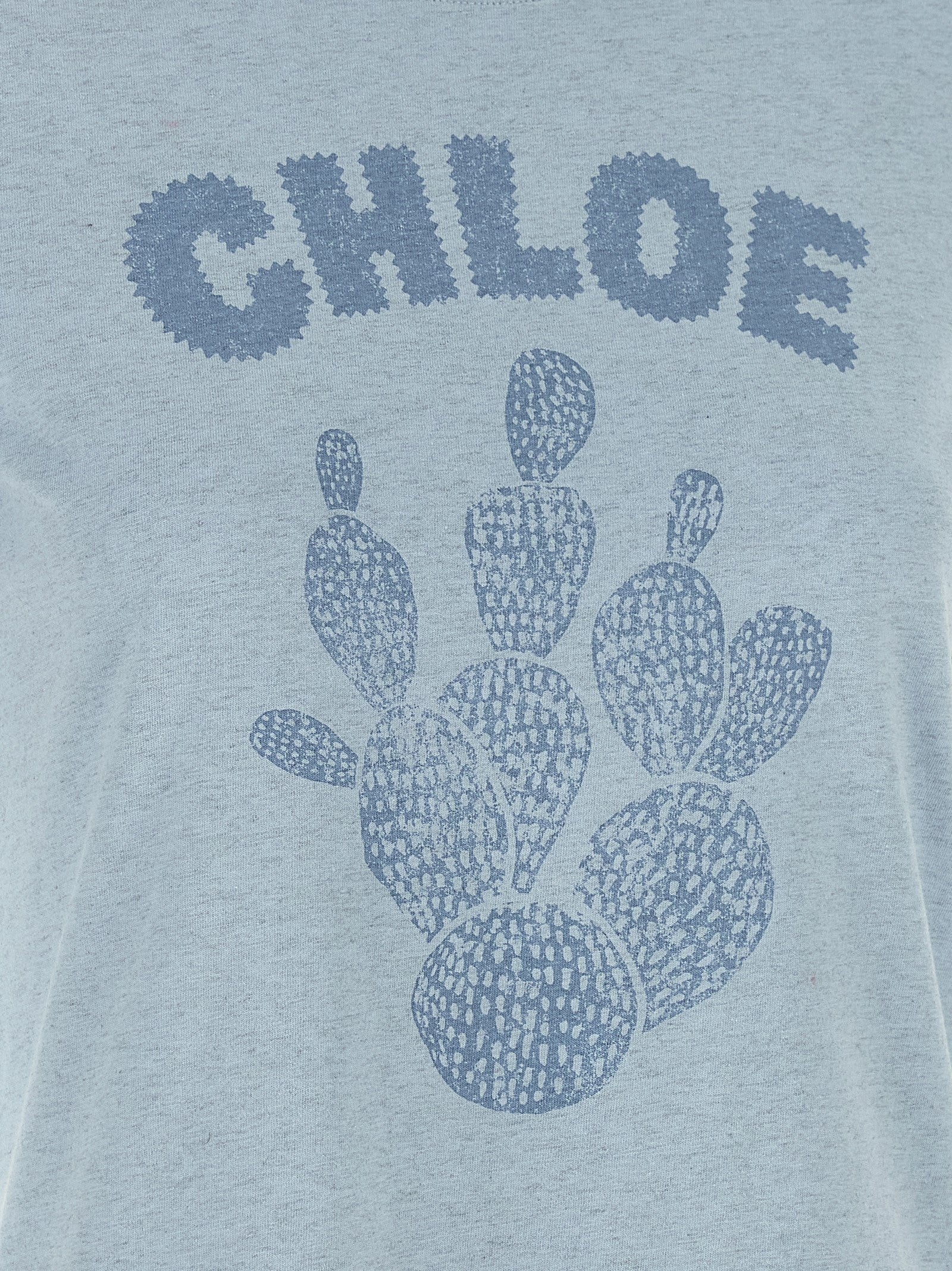 Elevate your wardrobe with the Chloé Blue Cotton T-Shirt, a luxurious blend of comfort and sophistication, perfect for the discerning individual seeking effortless style.