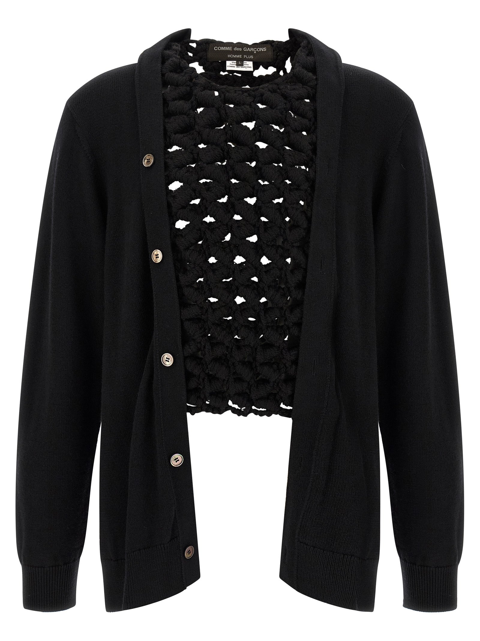 Experience the avant-garde allure of the Comme Des Garçons Black Wool Cardigan, a masterpiece of craftsmanship that redefines luxury knitwear for the discerning individual.