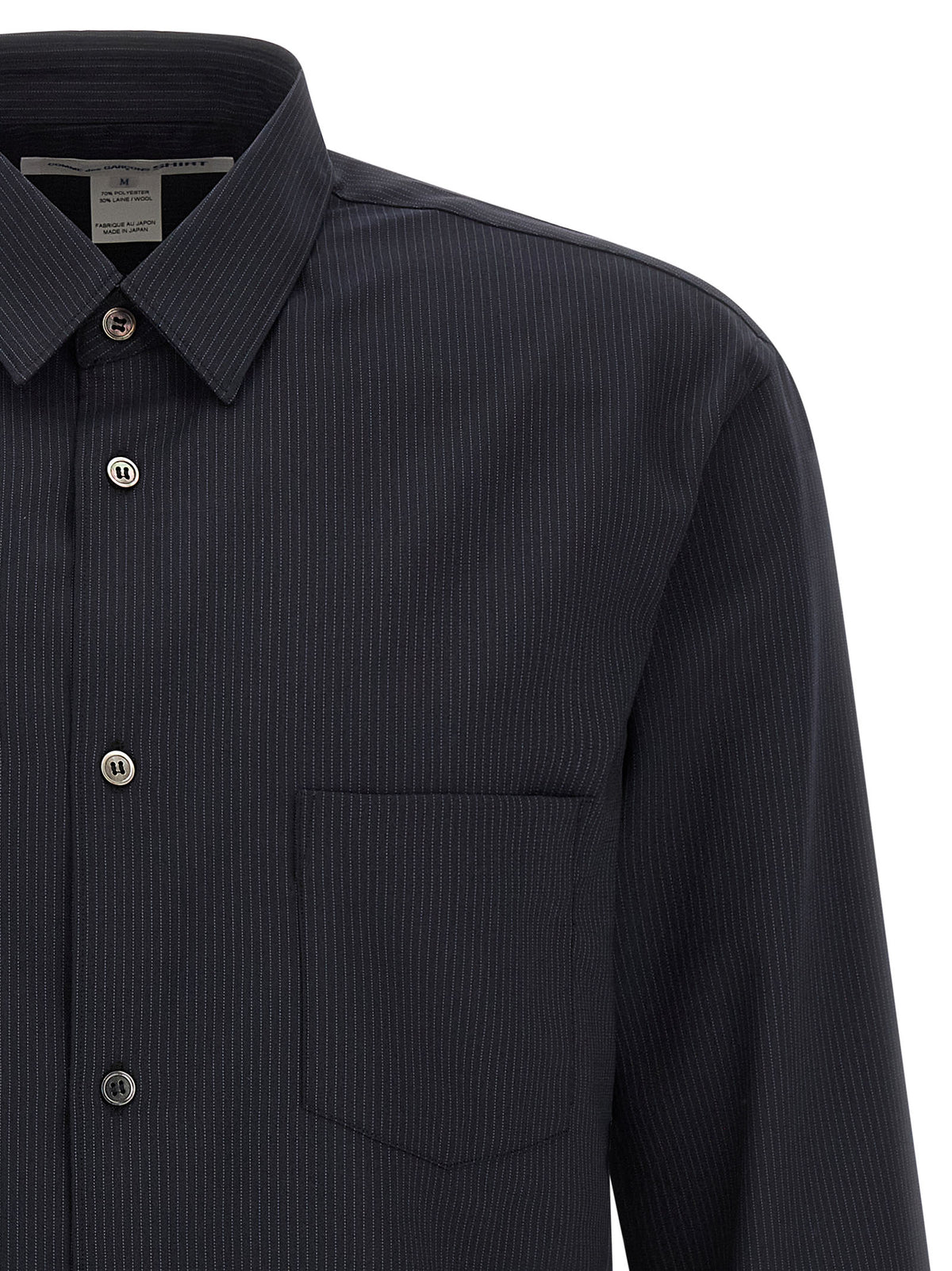 Discover the exquisite Comme Des Garçons Blue Polyester Blouse, a masterful blend of elegance and modernity, crafted for those who appreciate refined sophistication.