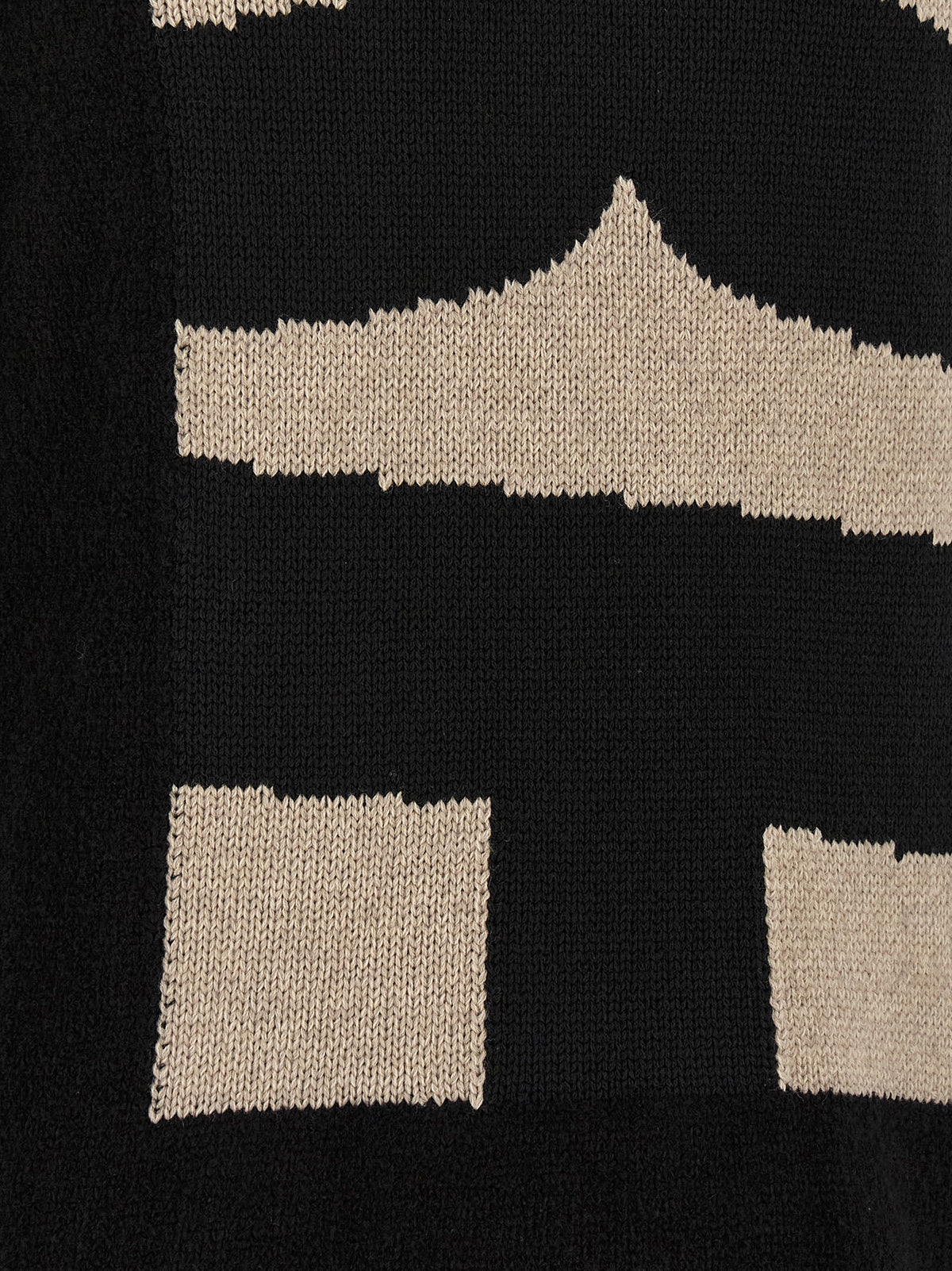 Elevate your wardrobe with the Comme Des Garçons Black Polyester Cardigan, a masterpiece of avant-garde design and luxurious comfort, crafted for the discerning individual.