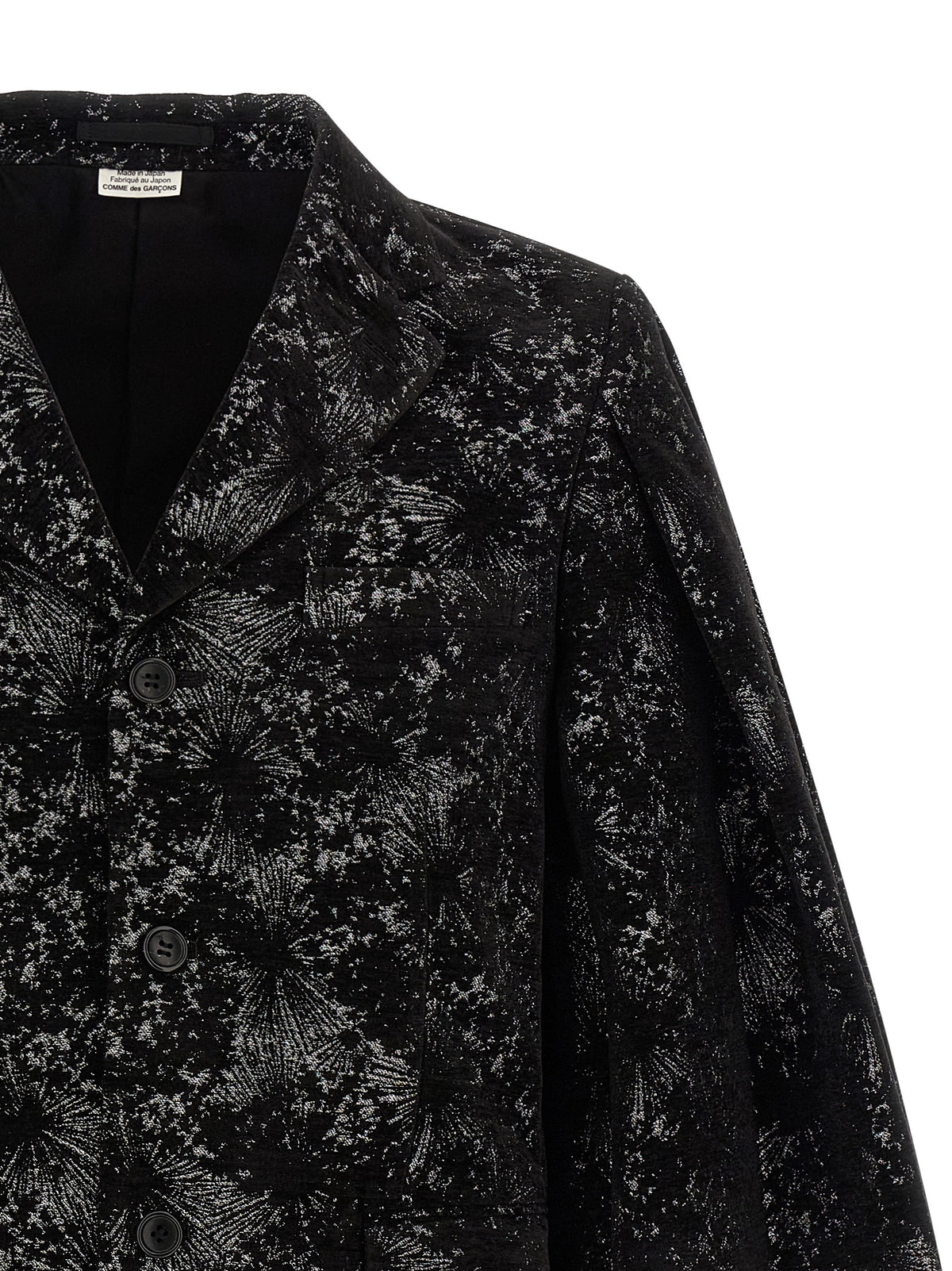 Experience the avant-garde elegance of the Comme Des Garçons Black Polyester Blazer, a masterful blend of artistry and sophistication, perfect for the discerning individual.