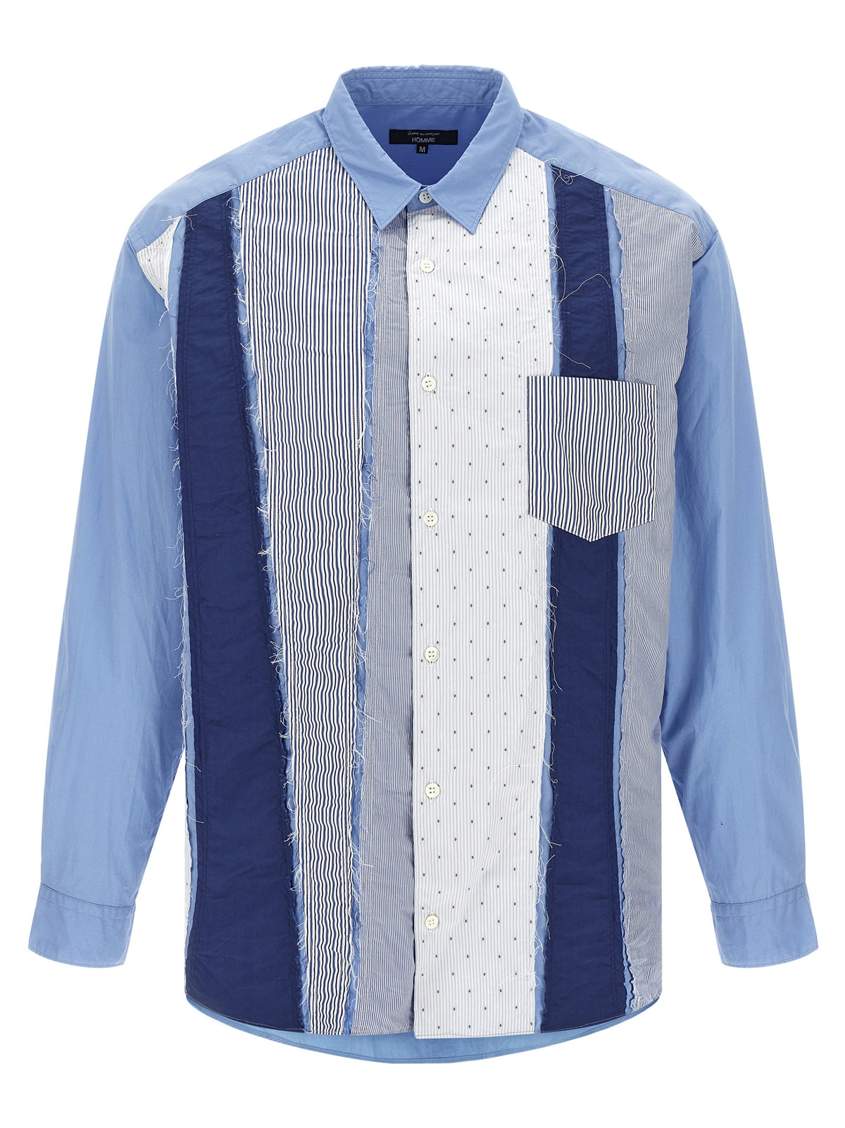 Elevate your wardrobe with the Comme Des Garçons Blue Cotton Blouse, a masterpiece of deconstructed elegance, crafted in Japan from luxurious cotton for the discerning fashion connoisseur.