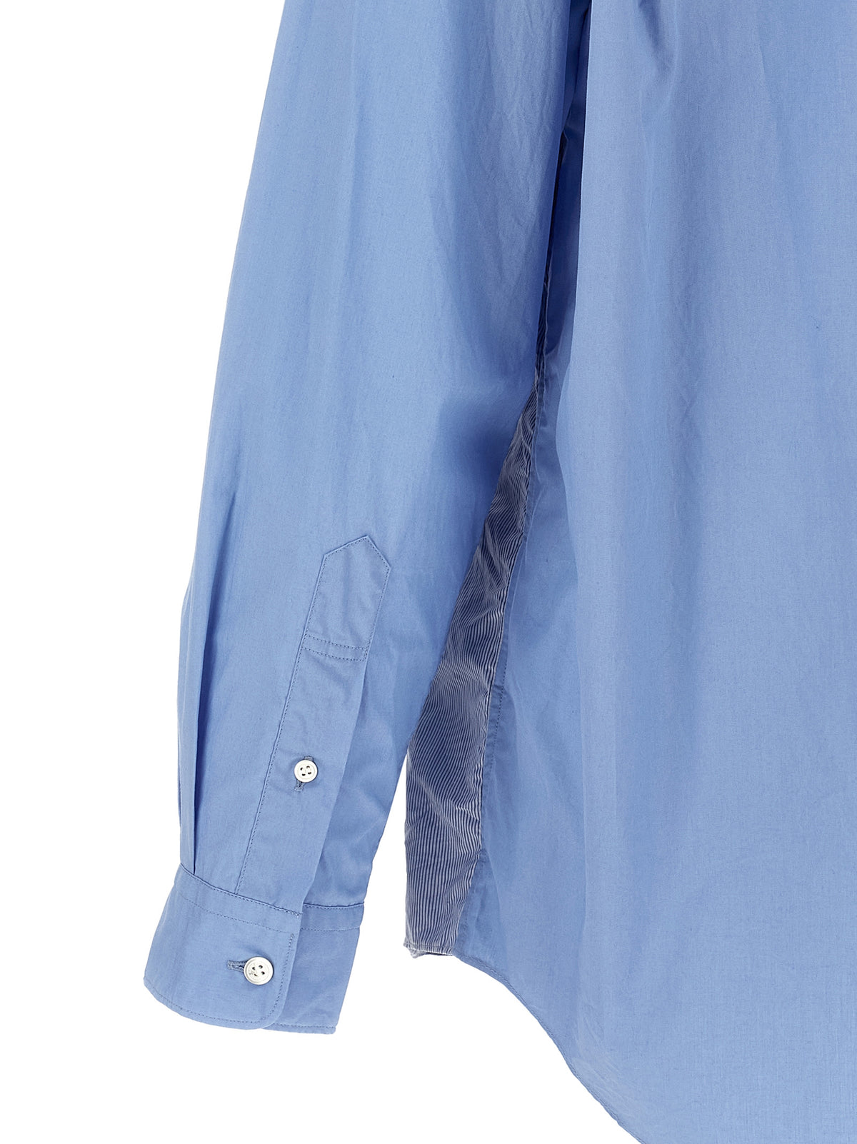 Elevate your wardrobe with the Comme Des Garçons Blue Cotton Blouse, a masterpiece of deconstructed elegance and luxurious craftsmanship, perfect for the discerning fashion connoisseur.