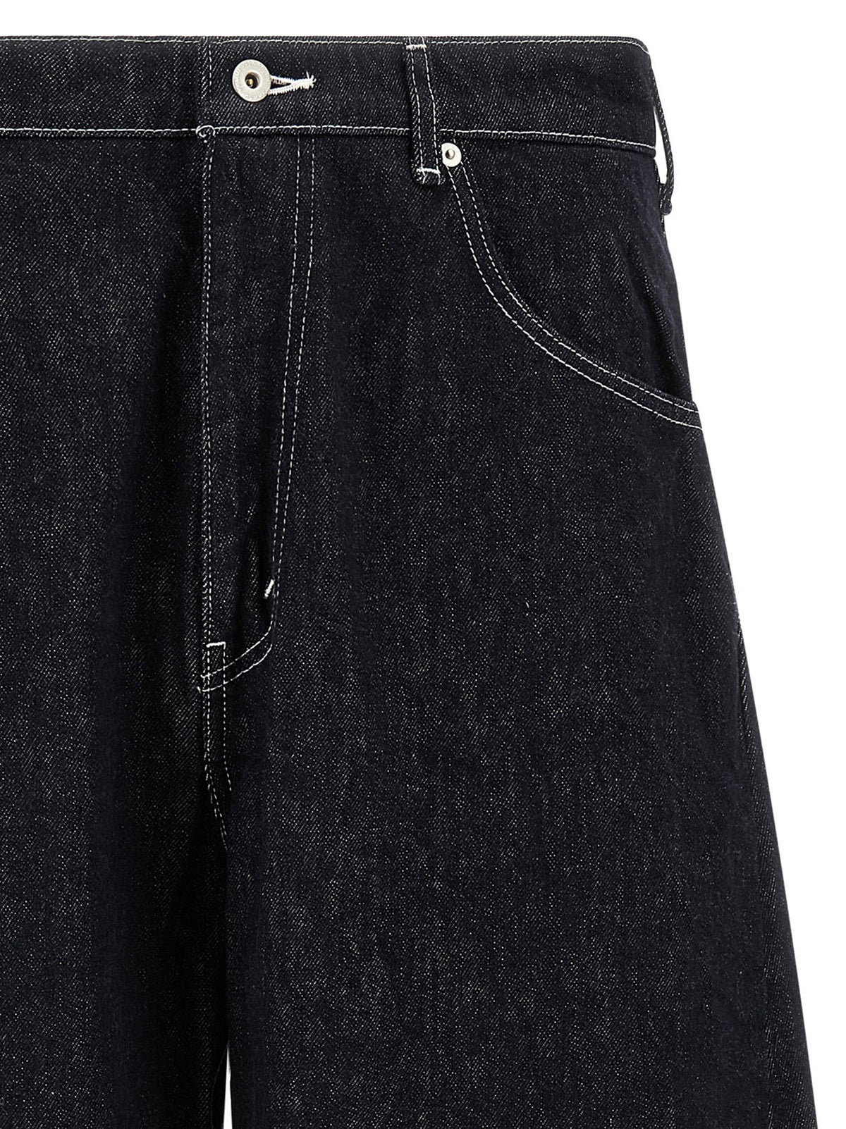 Experience the bold craftsmanship of Comme Des Garçons Blue Cotton Jeans, where dynamic silhouettes meet exquisite Japanese denim, redefining modern luxury for the discerning individual.