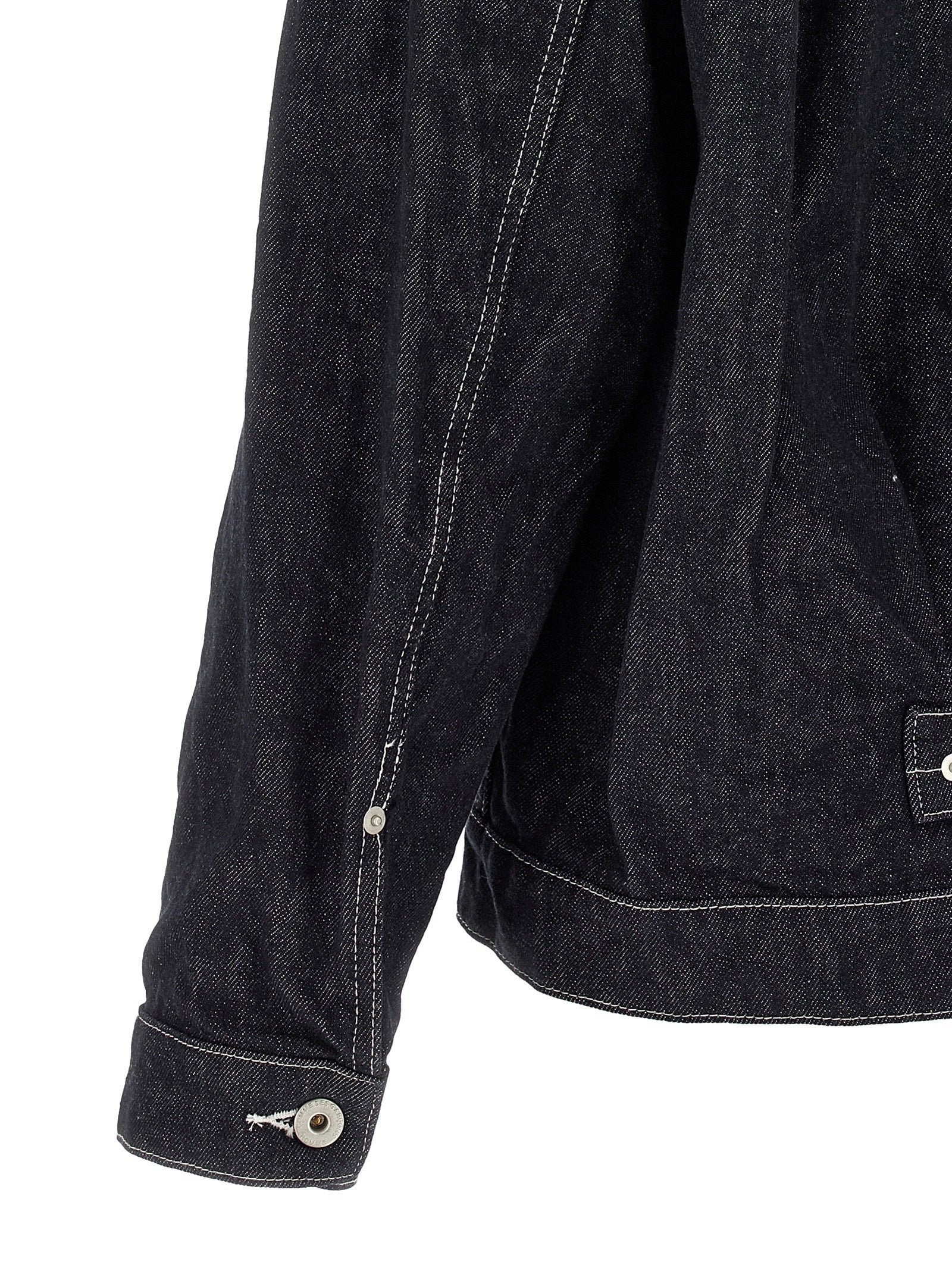 Indulge in the avant-garde elegance of the Comme Des Garçons Blue Cotton Denim Jacket, a masterpiece of Japanese craftsmanship that redefines luxury workwear.