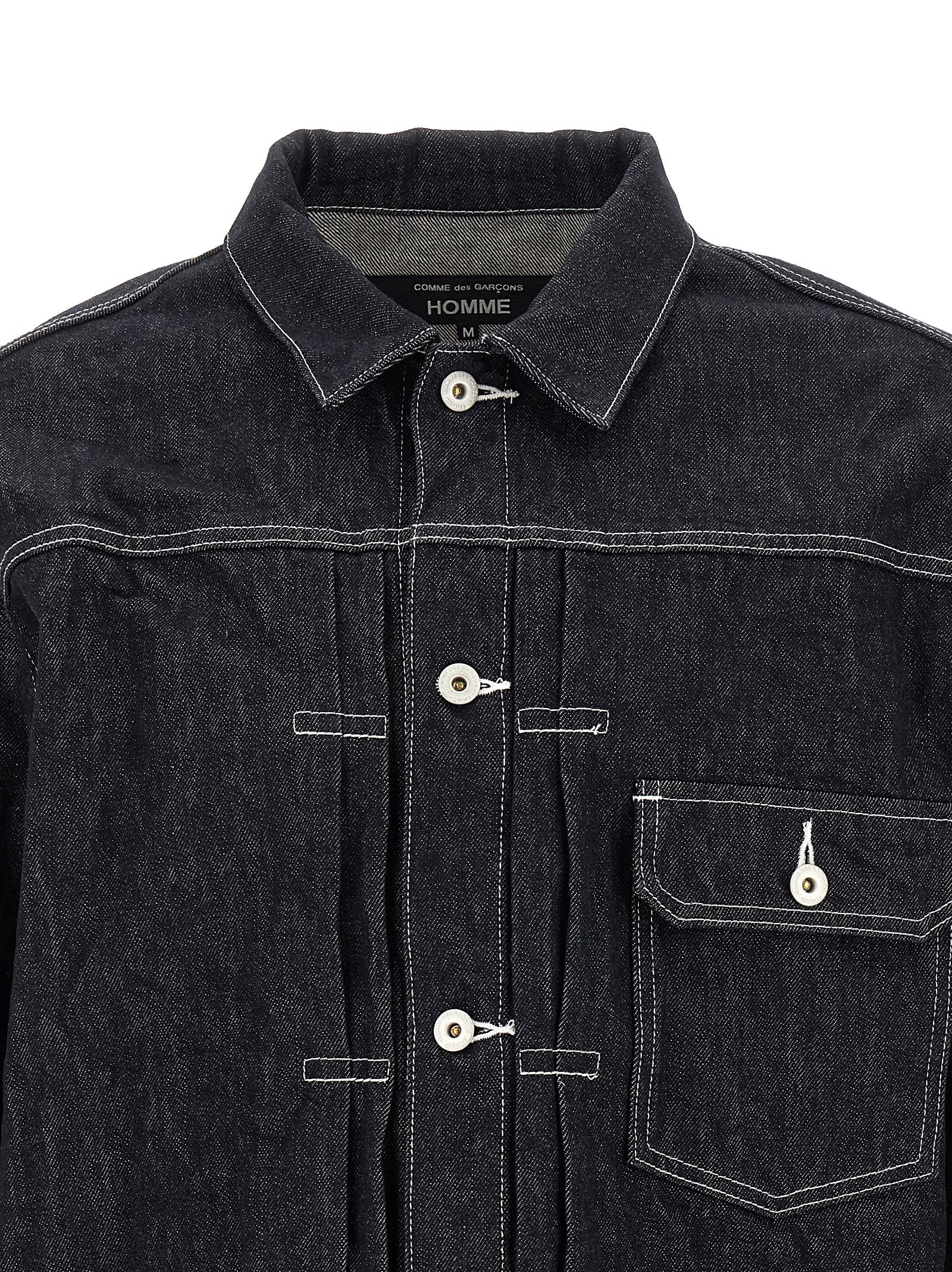 Indulge in the avant-garde elegance of the Comme Des Garçons Blue Cotton Denim Jacket, where Japanese craftsmanship meets bold style, perfect for the discerning fashion connoisseur.
