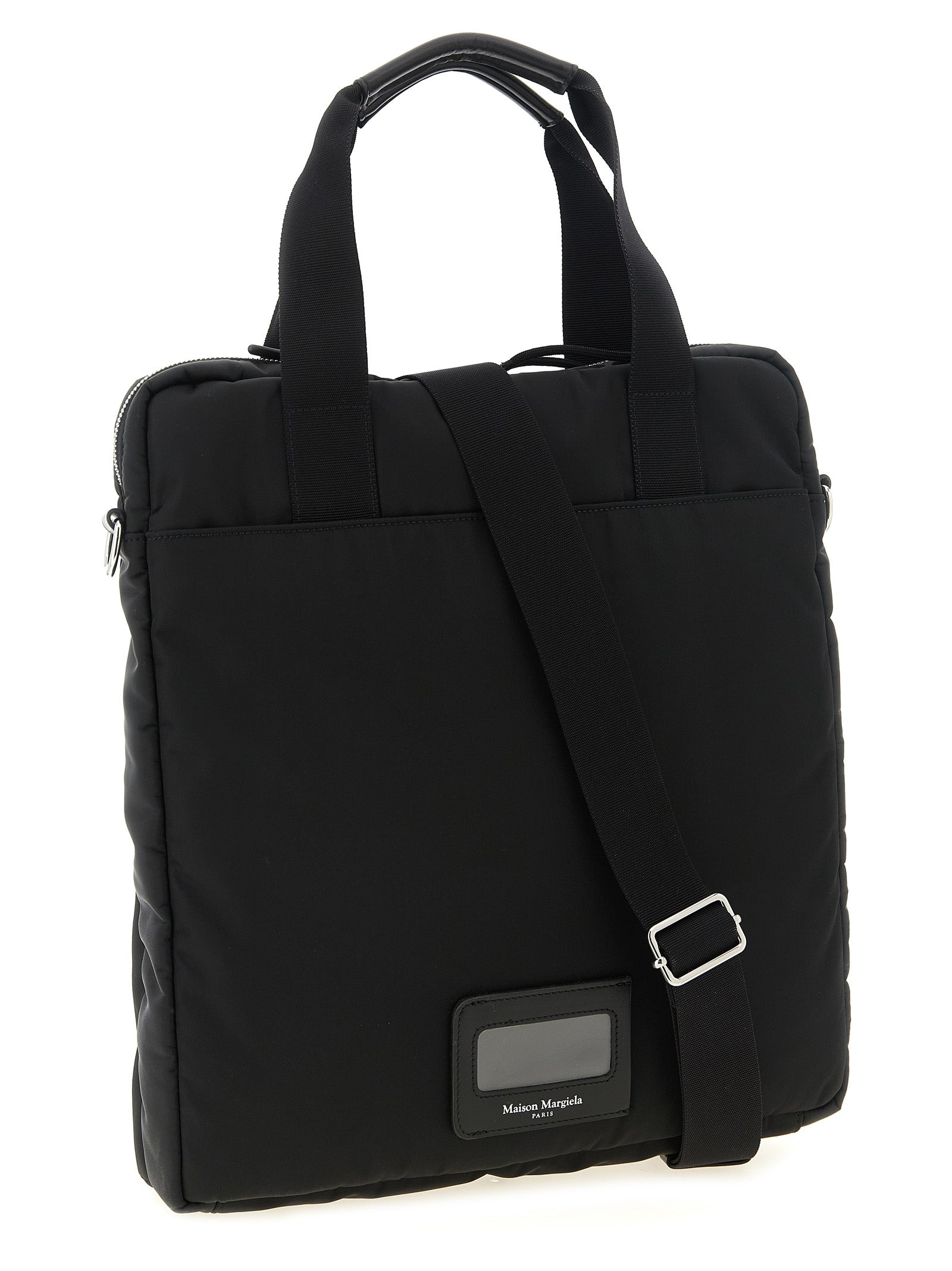 Discover the Maison Margiela Black Polyamide Tote Bag, a fusion of industrial elegance and timeless allure, perfect for the discerning individual seeking sophistication.