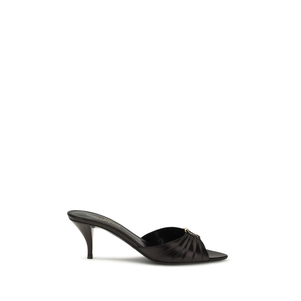 Experience the allure of Saint Laurent's Black Calf Leather Bos Taurus Sandals, where exquisite craftsmanship meets timeless elegance, perfect for any sophisticated occasion.