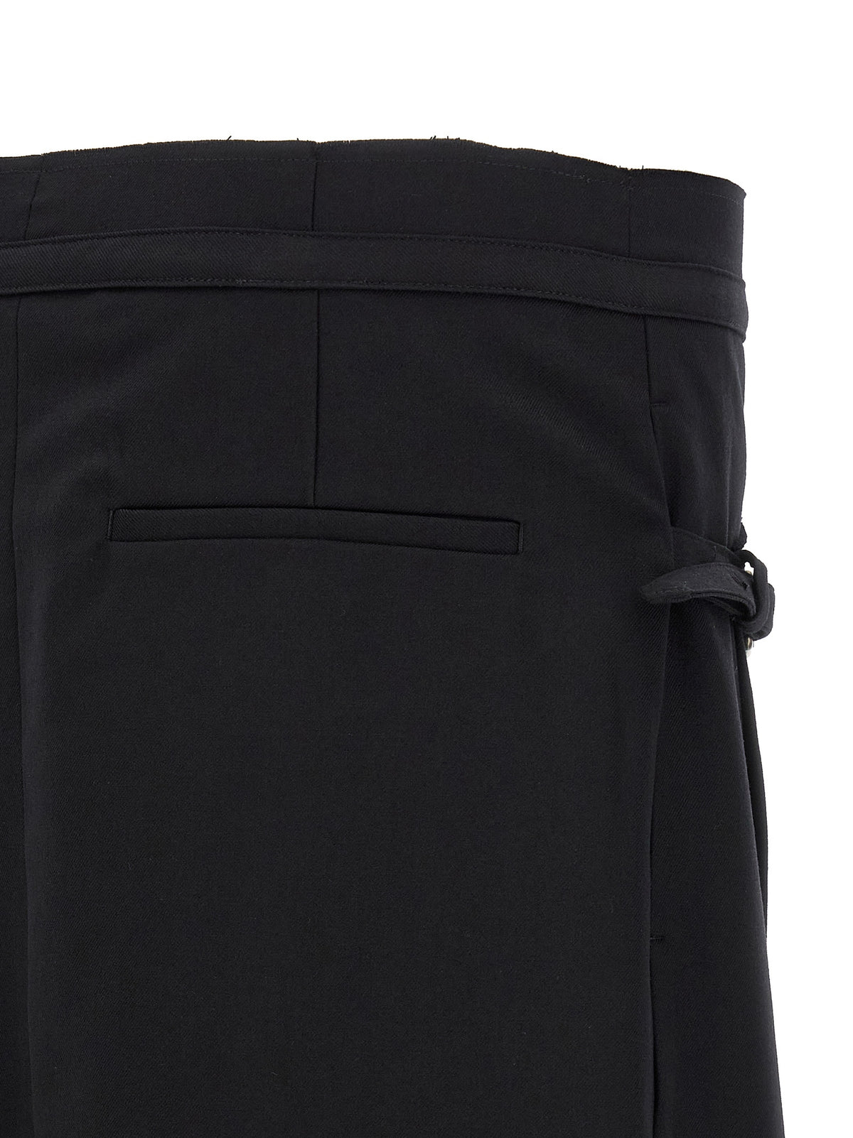 Discover the Dries Van Noten Black Wool Long Skirt, an exquisite blend of tailored elegance and avant-garde design, crafted for those who embrace timeless luxury.