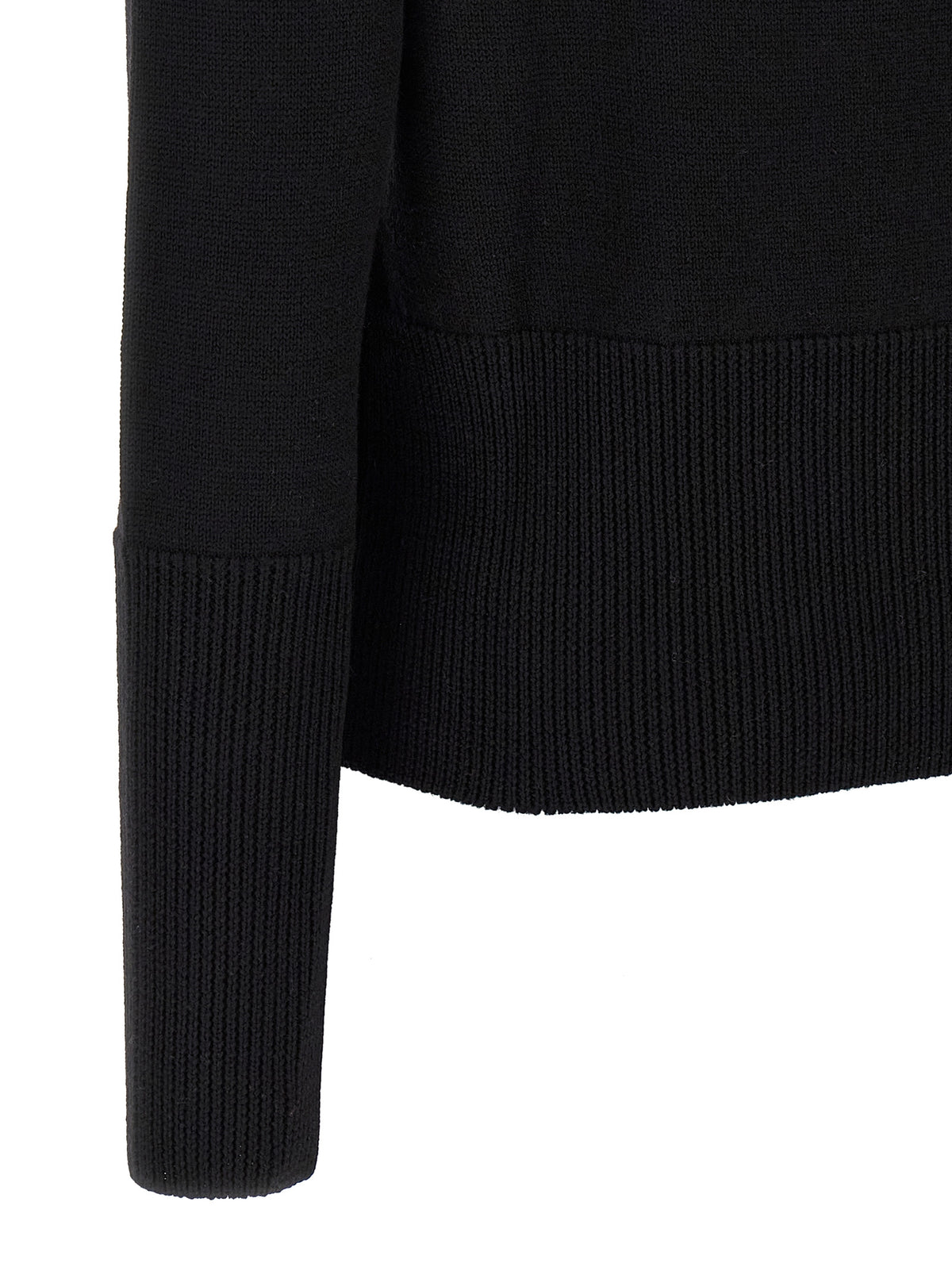 Experience the allure of the Vivienne Westwood Black Wool Cardigan, a timeless masterpiece crafted from 100% fine wool, embodying elegance and sophistication for the discerning individual.