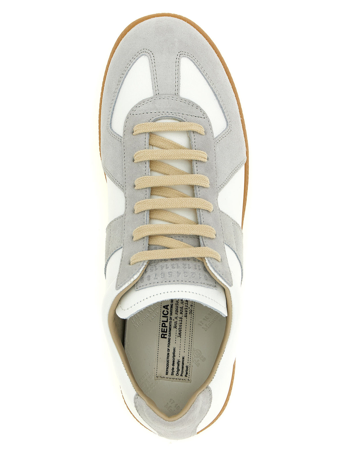 Indulge in the Maison Margiela White Calfskin Sneakers, where exquisite craftsmanship meets timeless elegance, elevating your style with luxurious comfort and sophistication.