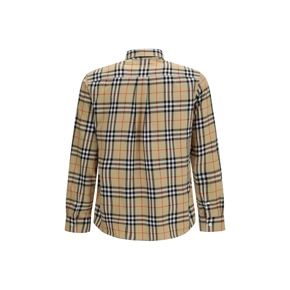 Indulge in the elegance of the Burberry Check Cotton Shirt, a masterpiece of 100% cotton craftsmanship, embodying timeless luxury and effortless sophistication for discerning tastes.