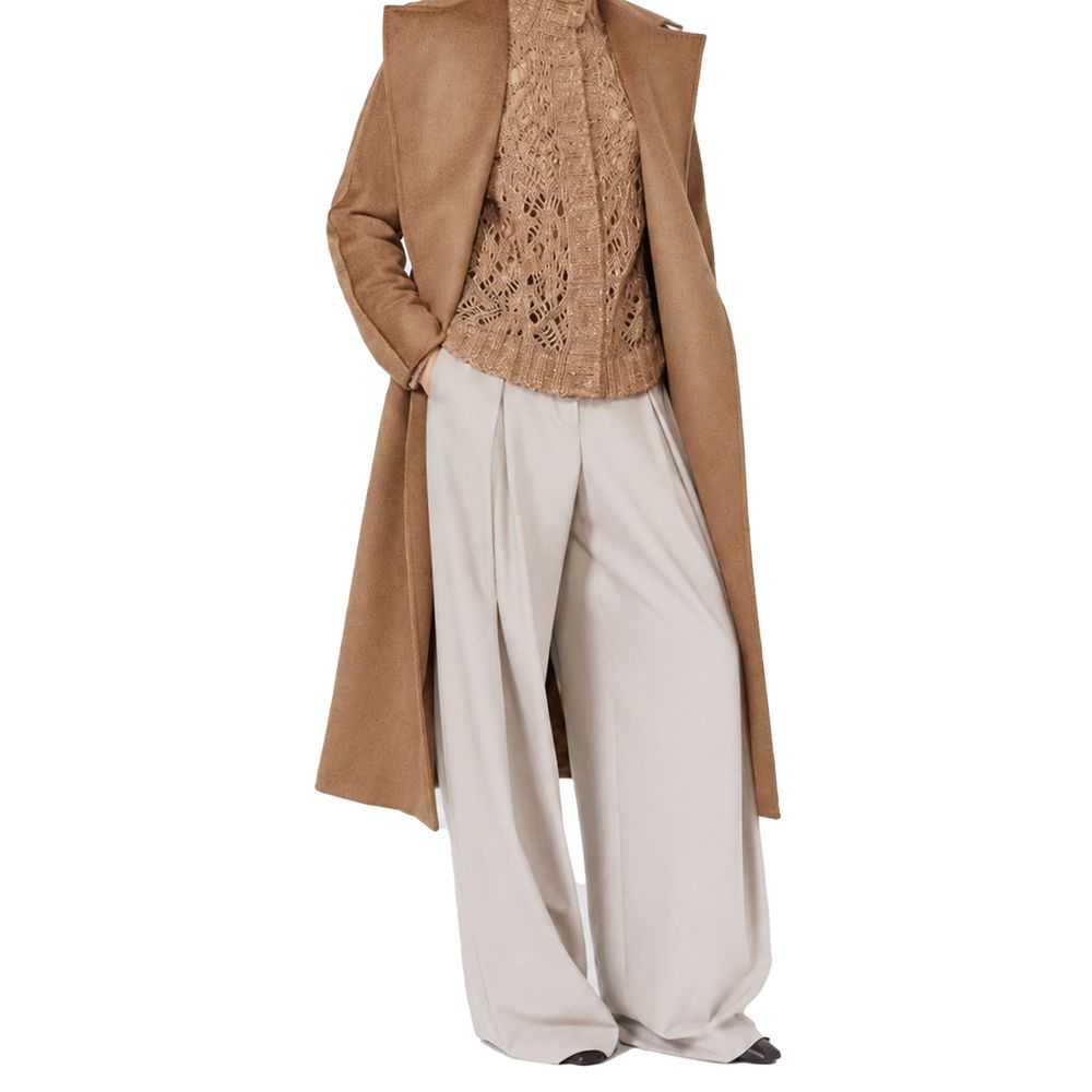 Indulge in the exquisite Max Mara Beige Elastane Casual Pants, crafted from luxurious virgin wool, embodying sophistication and effortless elegance for the discerning individual.