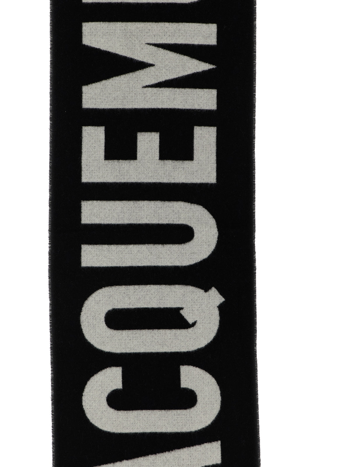 Elevate your style with the Jacquemus Black Wool Foulard, a luxurious 100% virgin wool accessory that embodies sophistication and timeless elegance for every occasion.