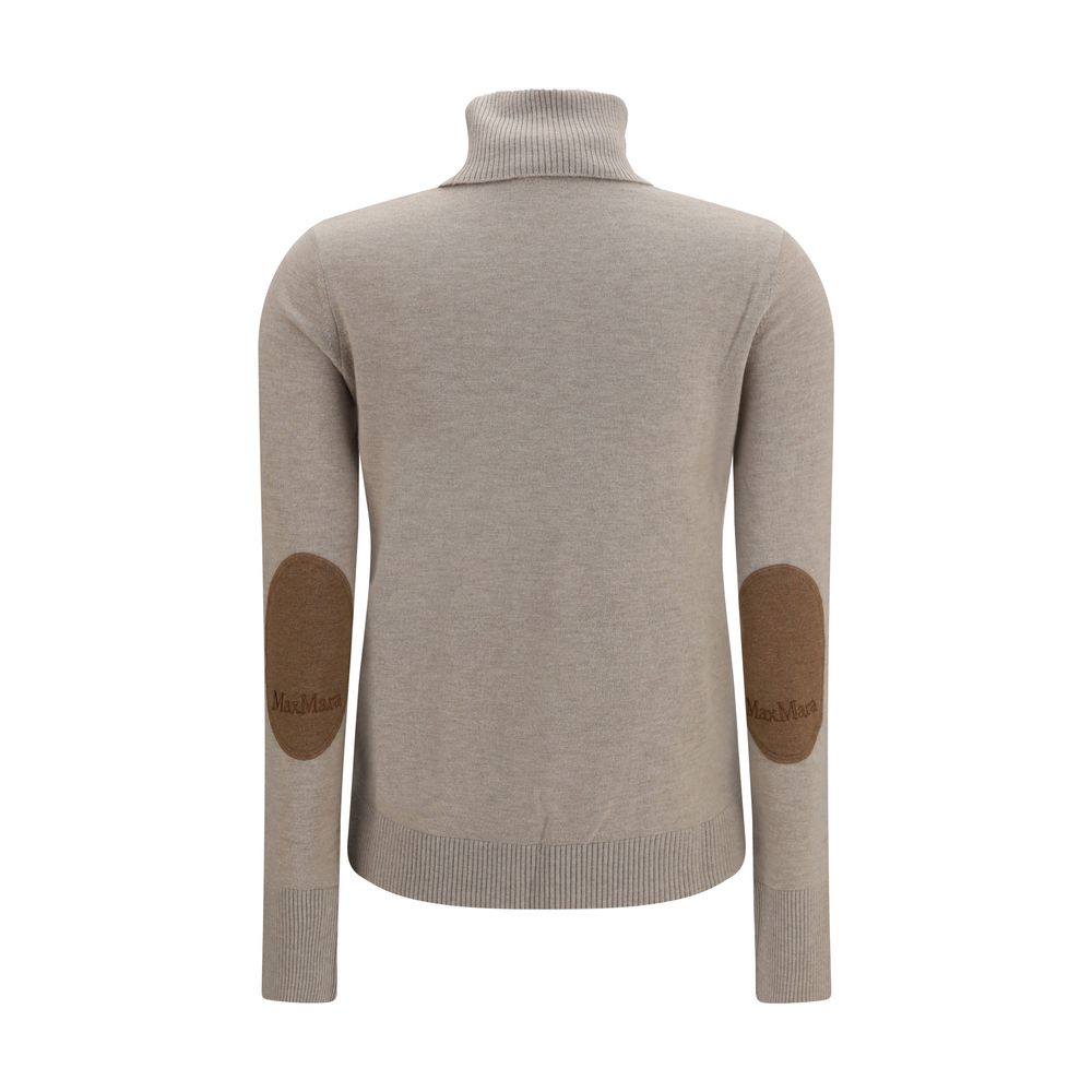 Indulge in the luxurious allure of 'S Max Mara Beige Wool Oves Aries Turtleneck, crafted from exquisite fleece wool, embodying timeless elegance for discerning tastes.