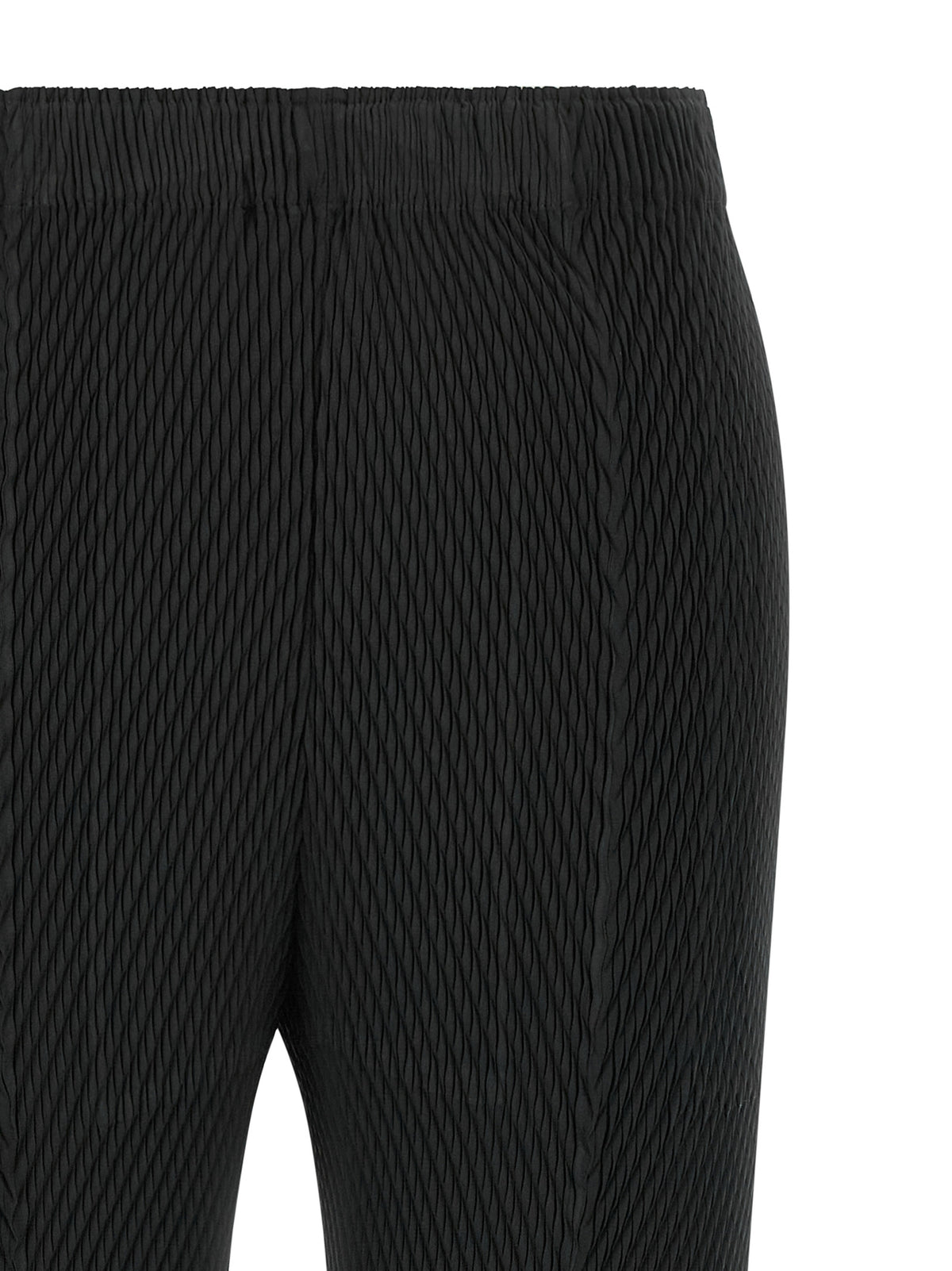 Elevate your style with Issey Miyake's Black Polyester Cropped Pants, a masterpiece of architectural elegance and innovative design, perfect for the discerning individual.