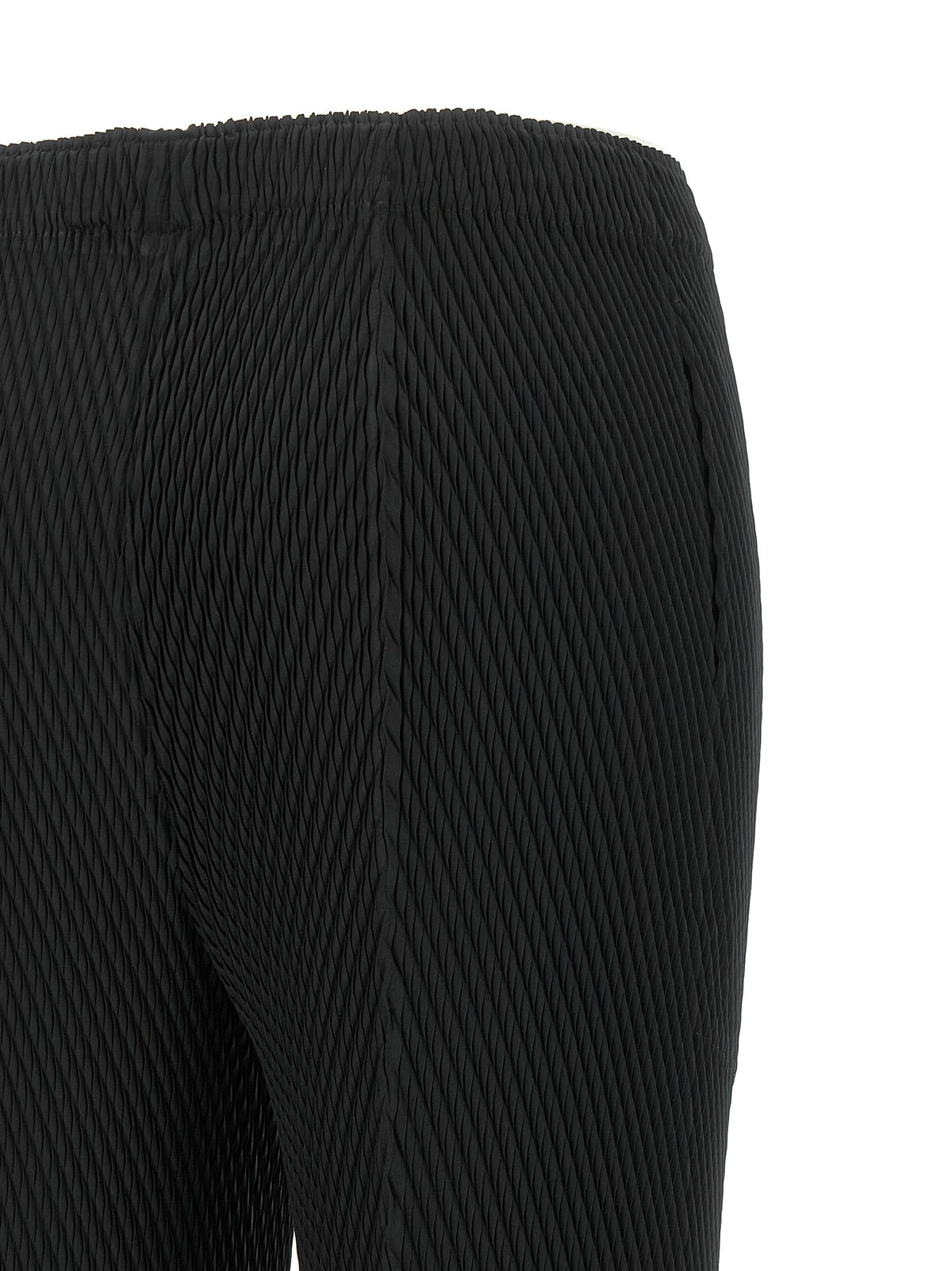 Discover the Issey Miyake Black Polyester Cropped Pants, a masterpiece of architectural elegance and innovative design, perfect for the discerning individual who values luxury and sophistication.