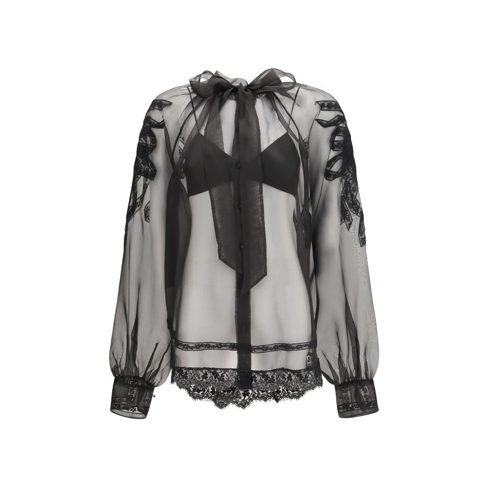 Indulge in the exquisite Ermanno Scervino Black Silk Blouse, a masterpiece of 100% silk that redefines luxury with its sheer elegance and sophisticated design.