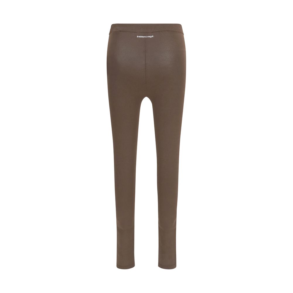 Indulge in the exquisite Balenciaga Brown Viscose Leggings, crafted from a luxurious blend for a flawless fit that elevates your everyday elegance and sophistication.