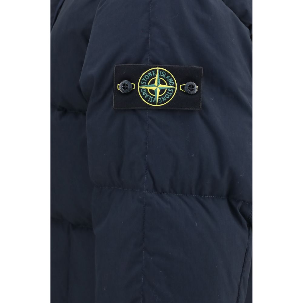 Indulge in the Stone Island Blue Goose Down Shell Jacket, a luxurious blend of comfort and sophistication, crafted for those who embody elegance and authority.