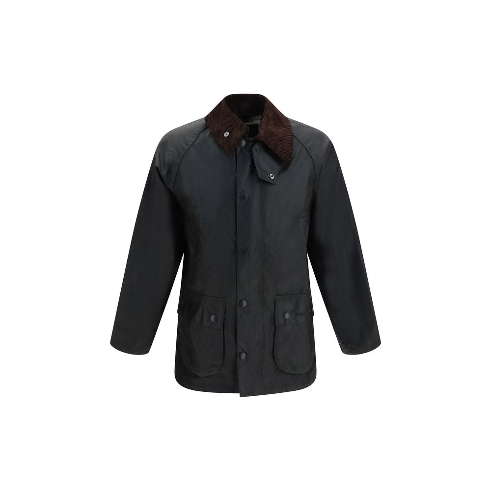 Elevate your wardrobe with the Barbour Black Cotton Full-Length Jacket, crafted from luxurious Thornproof waxed cotton, embodying sophistication and timeless elegance for every occasion.
