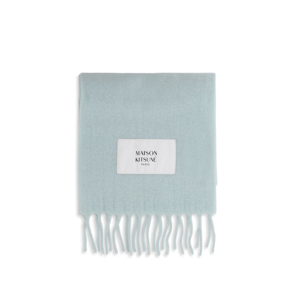 Indulge in the Maison Kitsuné Blue Polyamide Scarf, a masterful blend of alpaca and polyamide, exuding elegance and warmth for the discerning individual.