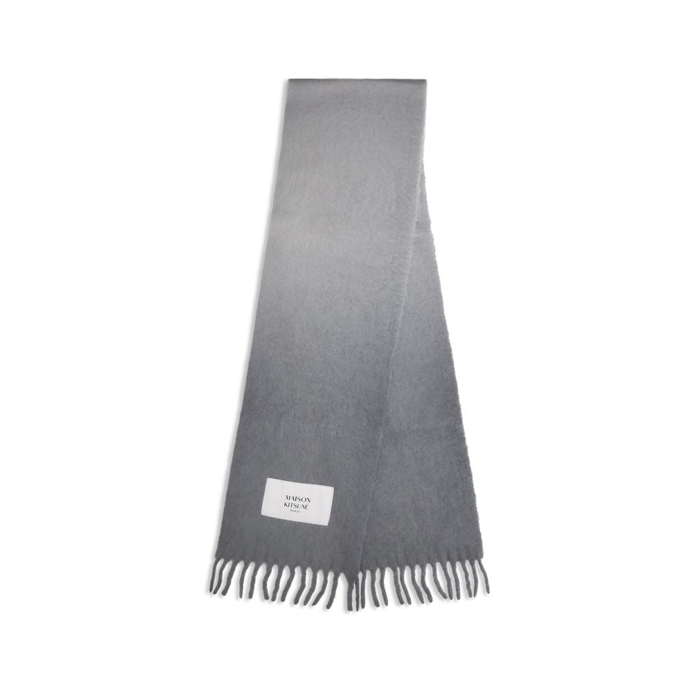 Experience the exquisite Maison Kitsuné Gray Alpaca Vicugna Pacos Scarf, crafted from 100% alpaca for unparalleled softness and warmth, embodying luxury and sophistication.