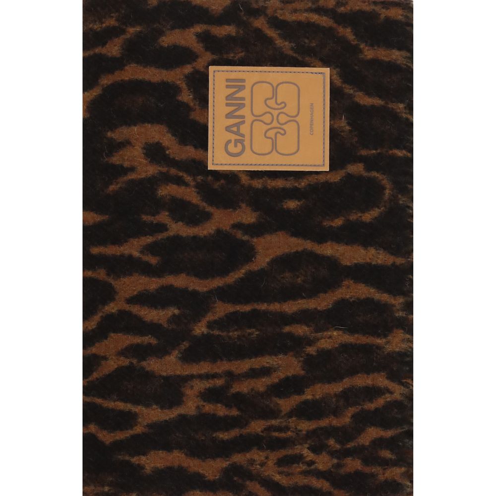 Indulge in the Ganni Brown Wool Oves Aries Scarf, a luxurious accessory crafted from 100% Ovis Aries wool, featuring an elegant leopard print that elevates any ensemble.