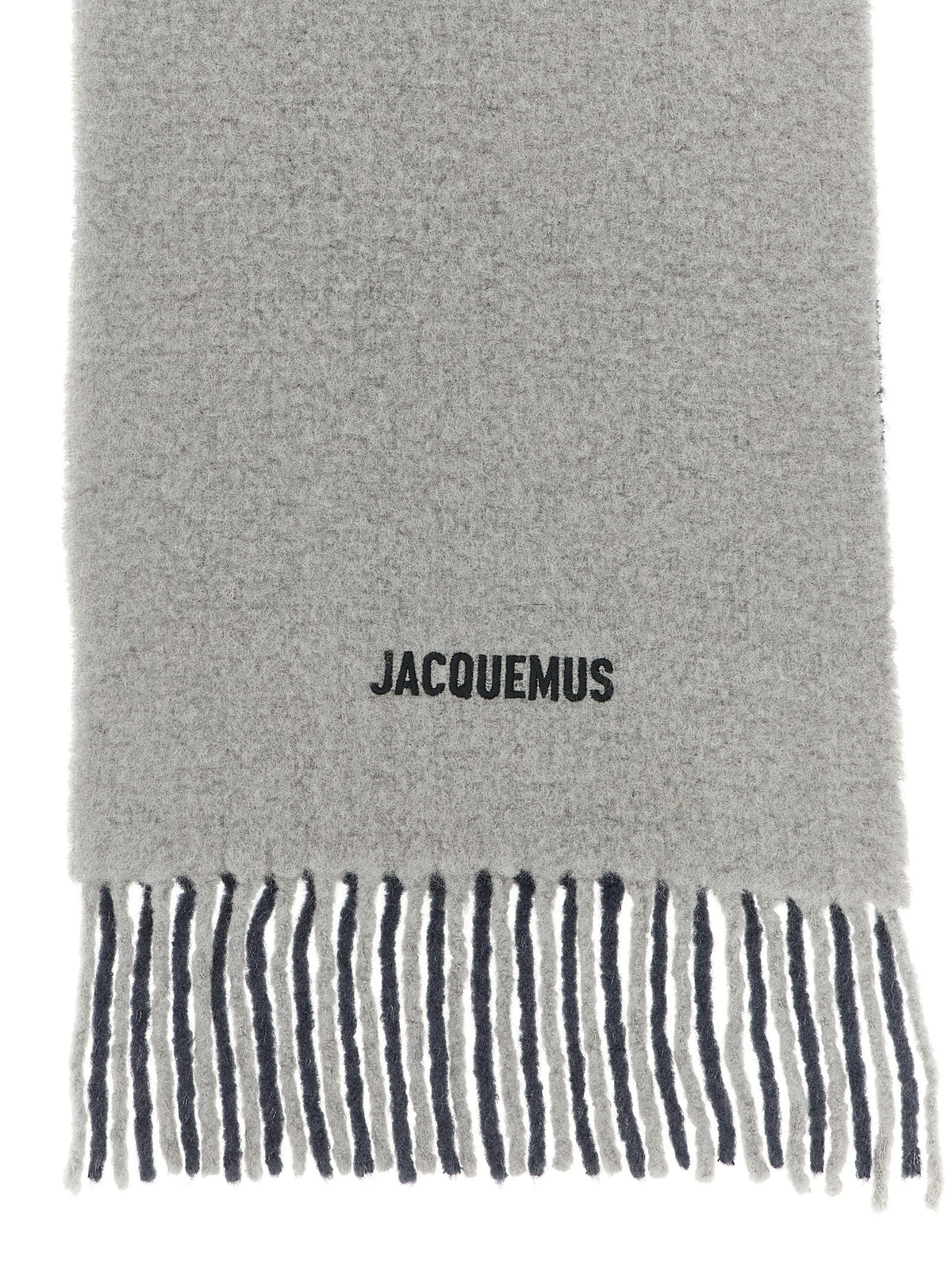 Experience the exquisite allure of the Jacquemus Gray Wool Scarf, a masterpiece of degradé alpaca wool, where timeless elegance meets unparalleled sophistication.