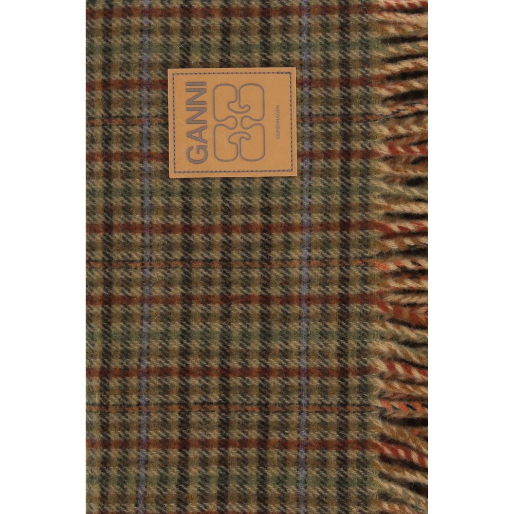 Experience the exquisite allure of the Ganni Brown Wool Oves Aries Scarf, crafted from 100% Wool Ovis Aries, embodying timeless elegance and luxurious warmth for every sophisticated occasion.