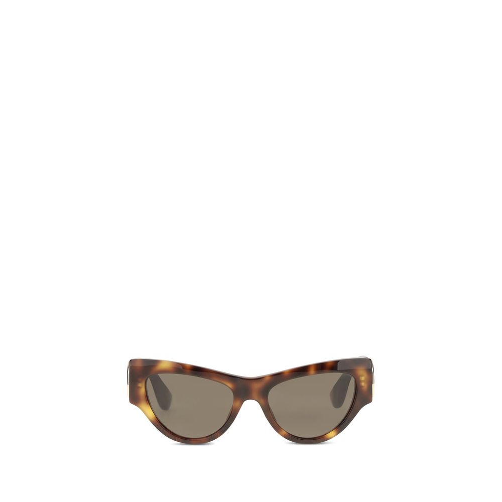 Indulge in the elegance of Valentino Garavani Brown Acetate Sunglasses, crafted from glossy recycled acetate, embodying luxury and sophistication for the discerning individual.