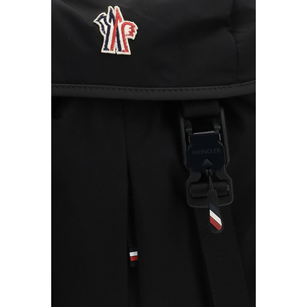 Experience the Moncler Grenoble Black Polyamide Backpack, a luxurious blend of 3-layer nylon and leather, designed for the discerning adventurer seeking elegance and functionality.