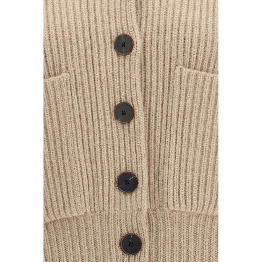 Indulge in the Tory Burch Beige Wool Oves Aries Cardigan, a masterpiece of merino wool that embodies refined elegance and effortless sophistication for the discerning individual.