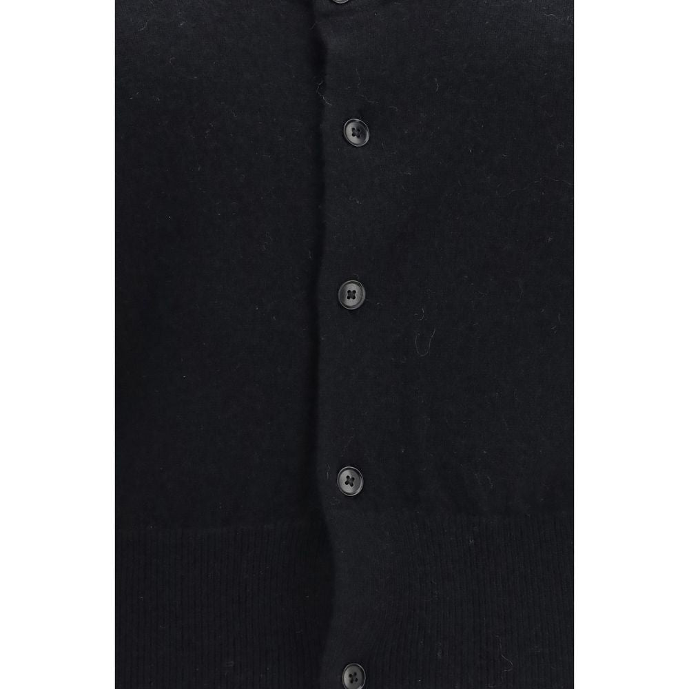 Elevate your wardrobe with the Extreme Cashmere Black Cashmere Cardigan from the AW26 collection, crafted from 100% cashmere for unparalleled luxury and sophistication.