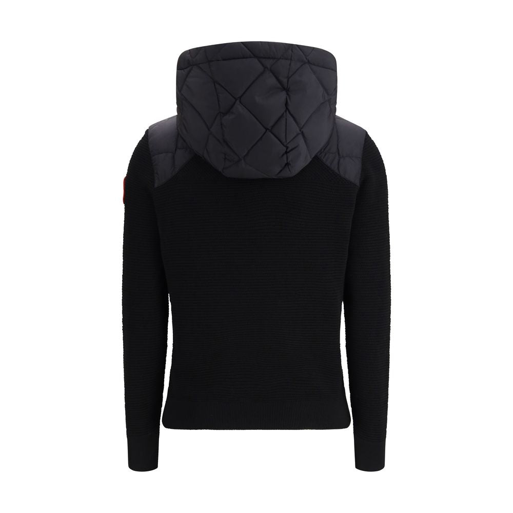 Elevate your style with the Canada Goose Black Wool Oves Aries Full-Length Jacket, a masterpiece of merino wool and Thermal Mapping® technology for unparalleled comfort and sophistication.