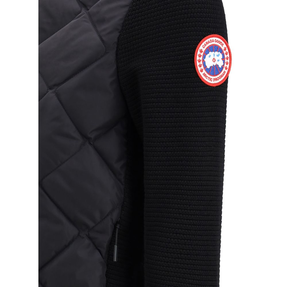 Indulge in the sophistication of the Canada Goose Black Wool Oves Aries Full-Length Jacket, a masterpiece of merino wool and innovative design, elevating your style with unparalleled warmth and elegance.