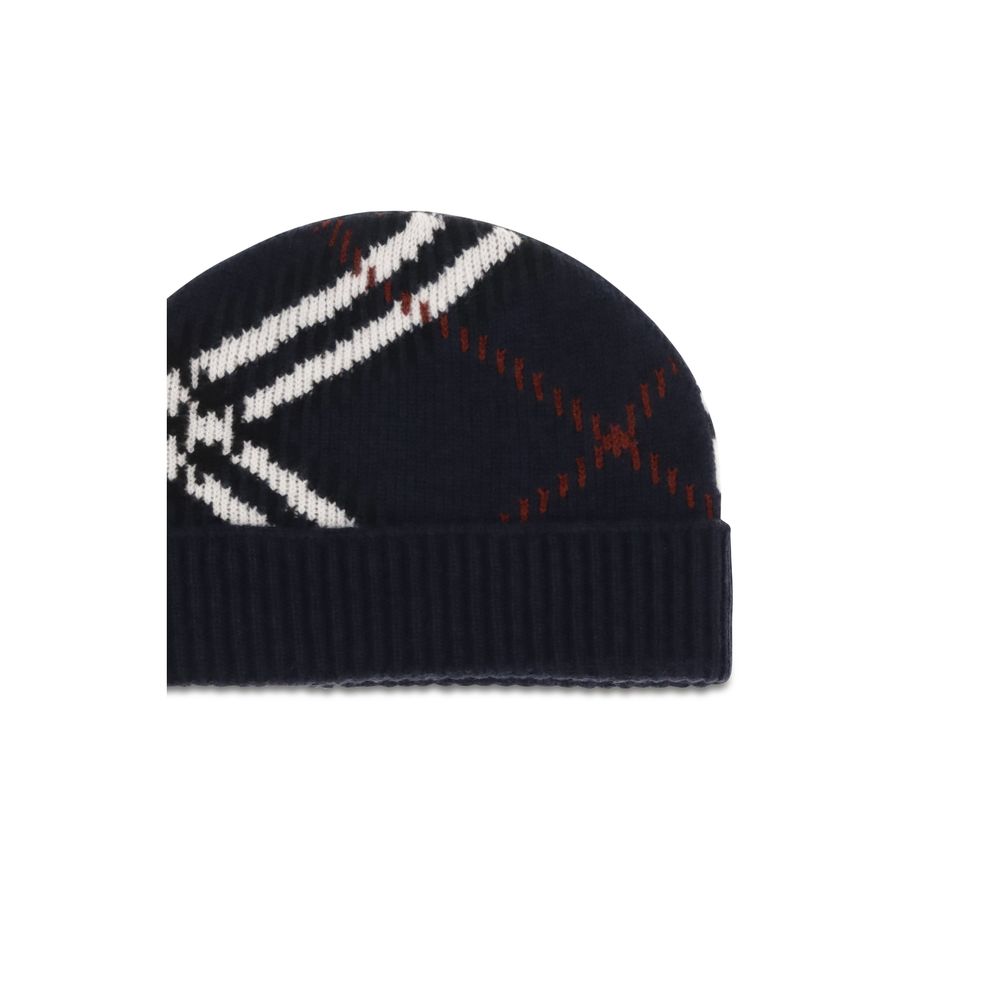 Indulge in the exquisite allure of the Burberry Blue Cashmere Beanie, crafted from a luxurious cashmere blend, embodying timeless elegance and sophisticated warmth.