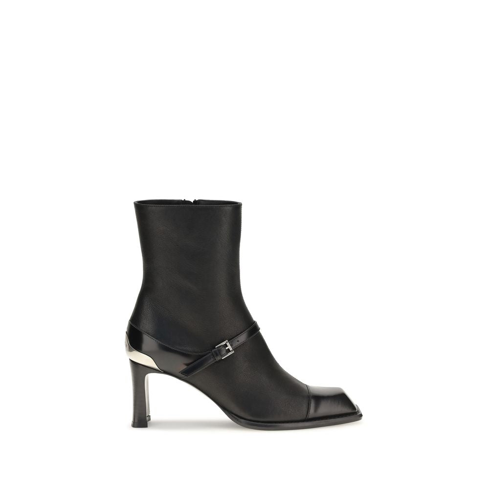 Elevate your style with Alexander McQueen's Niko Ankle Boots, crafted from sumptuous black lamb leather, embodying sophistication and timeless allure for the discerning fashion connoisseur.