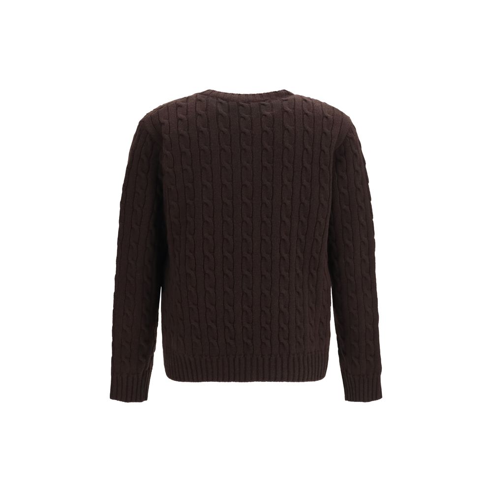 Indulge in the exquisite Valentino Garavani Brown Wool Oves Aries Cardigan, a masterpiece of cable-knit craftsmanship in luxurious merino wool, perfect for the discerning wardrobe.