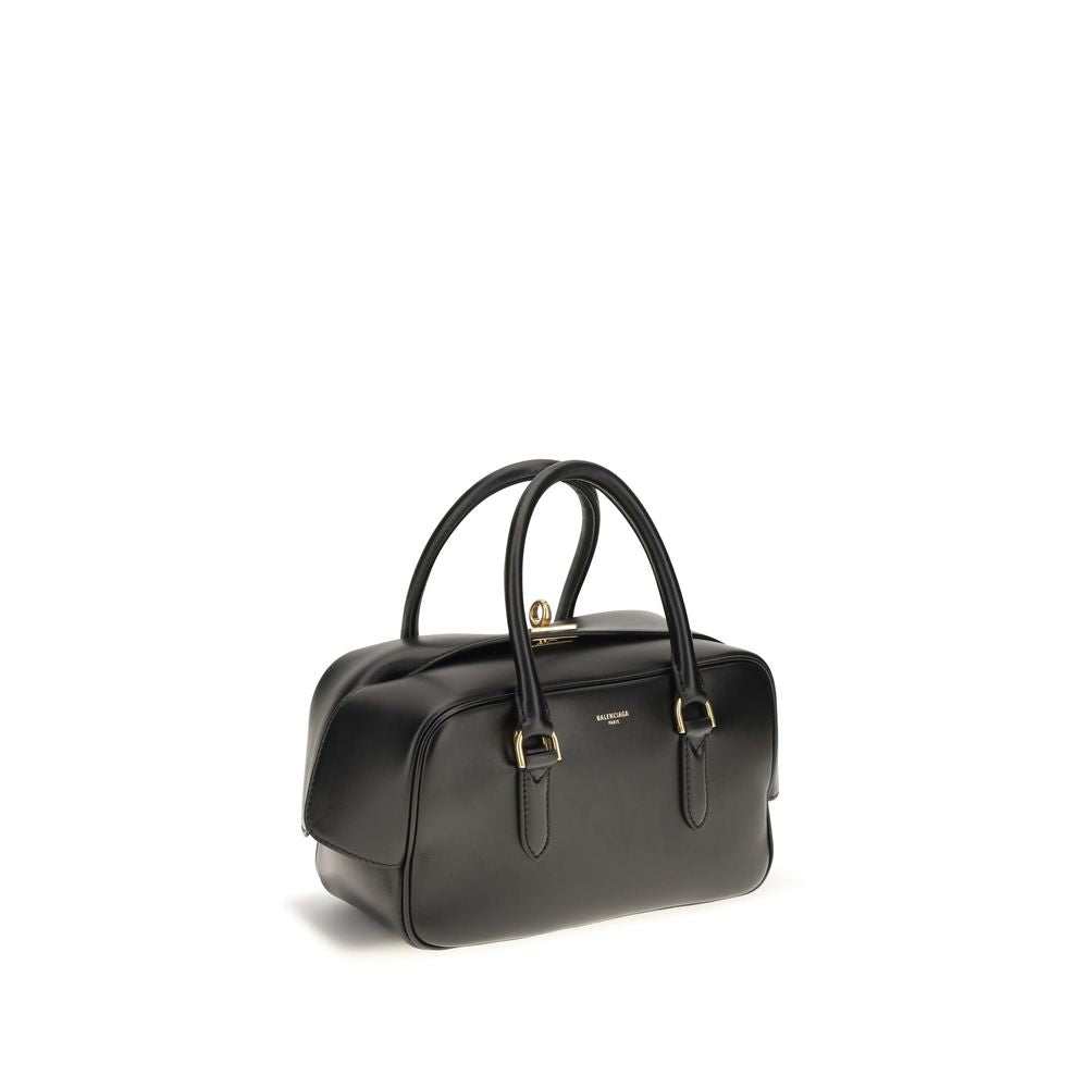 Discover the exquisite Balenciaga Black Lamb Leather Handbag, a masterpiece of Italian craftsmanship, blending luxury and versatility for the discerning individual.