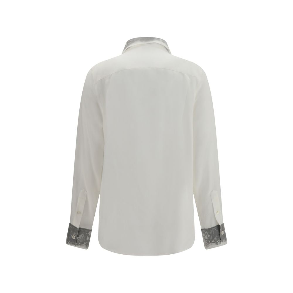 Experience the exquisite allure of the Alexander McQueen White Silk Dress Shirt, crafted from luxurious silk with delicate floral lace, a timeless piece for the discerning wardrobe.
